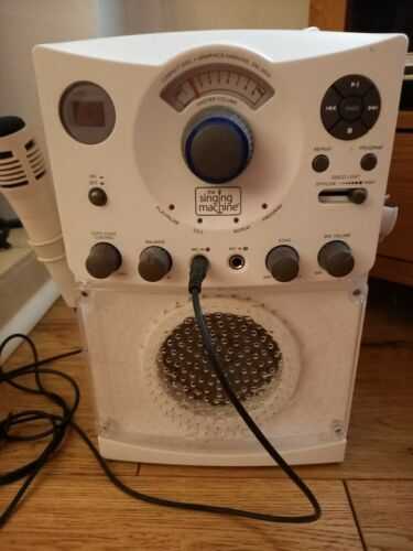 Karaoke machine used, complete with microphone and selection of cds. Cable missing