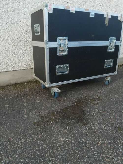 flight case on wheels, made for transporting televisions black.